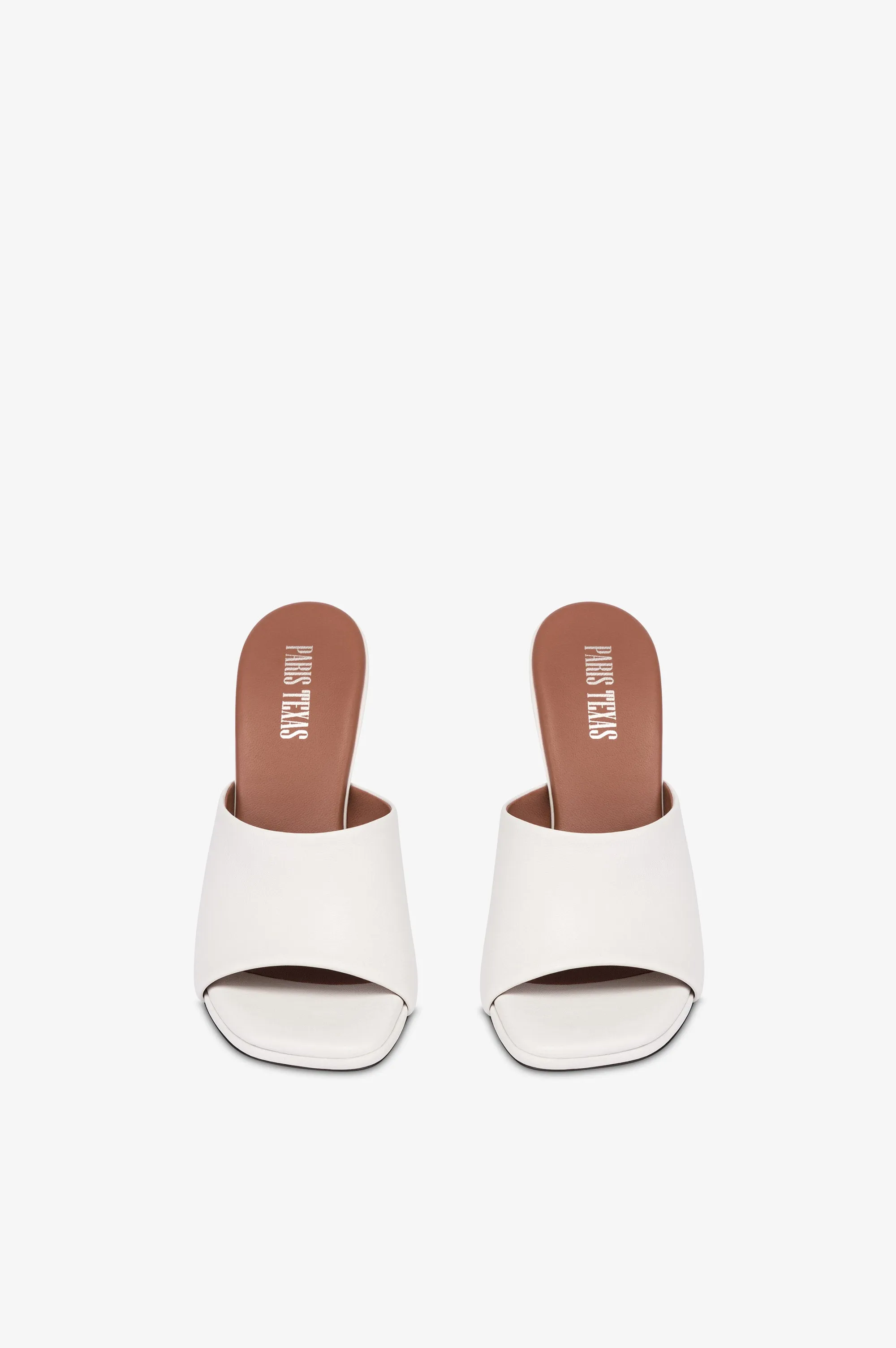 Mules in white leather