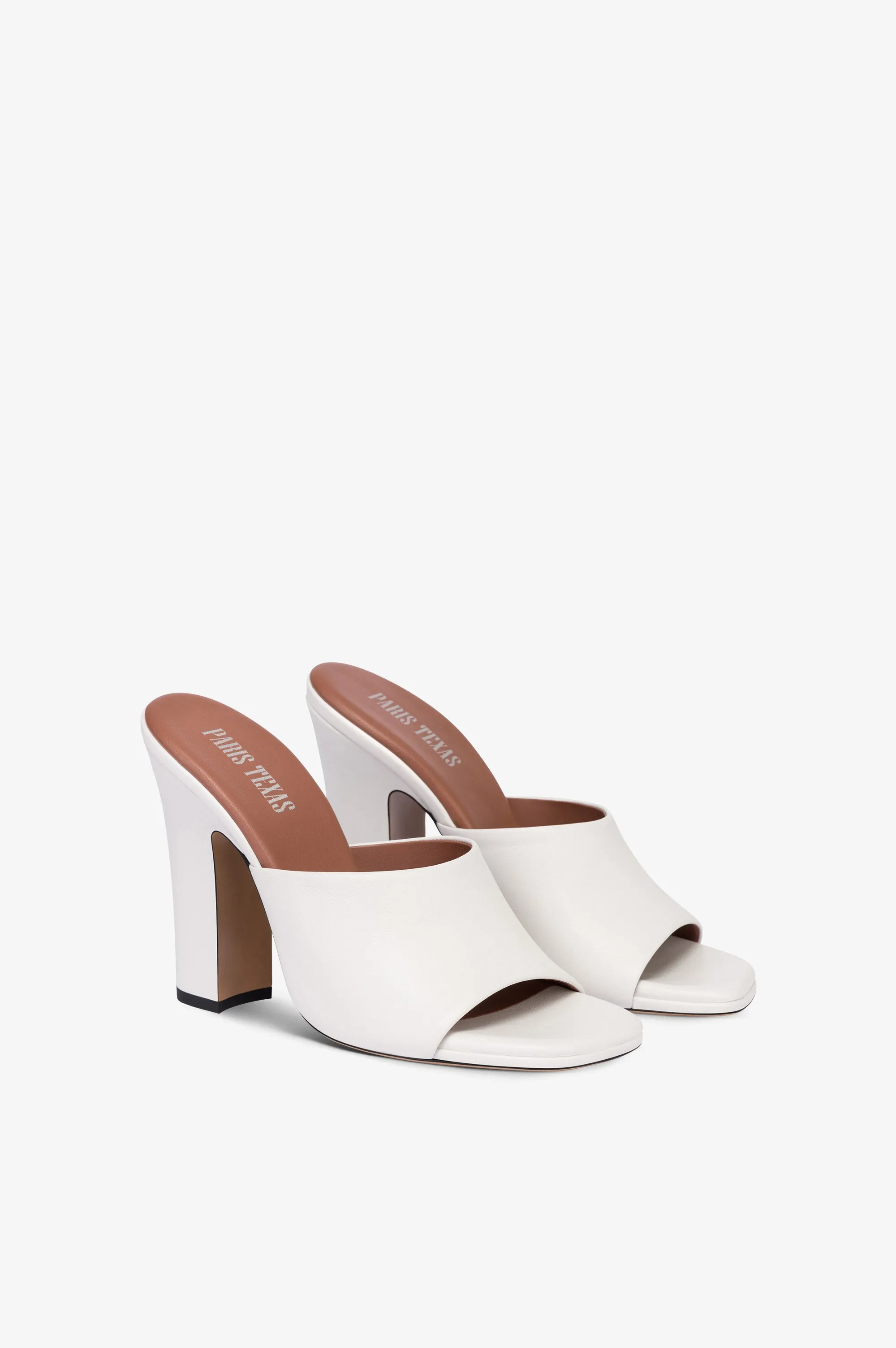 Mules in white leather